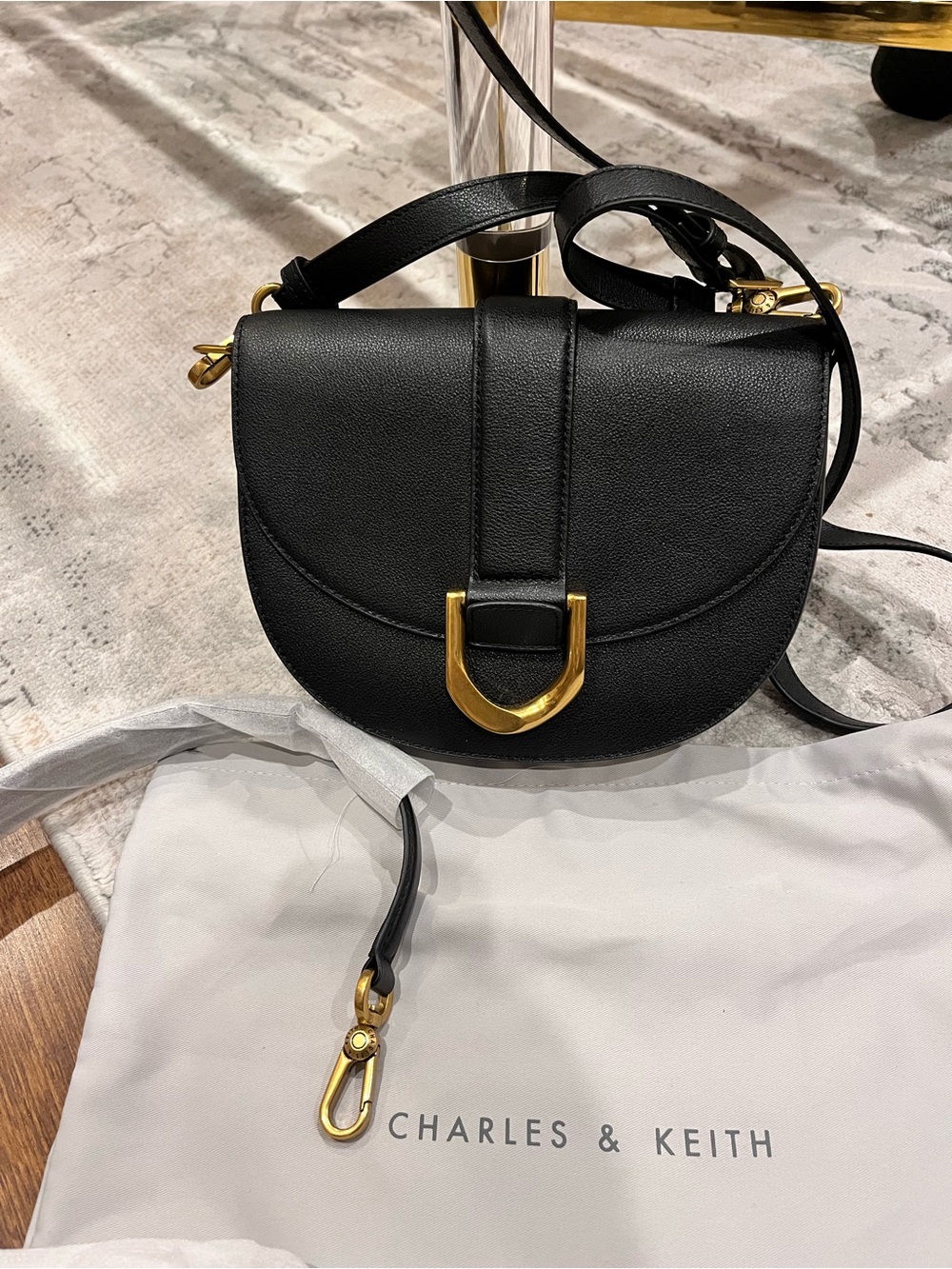 Charles & Keith Black Crossbody Saddle Bag with Gold Hardware